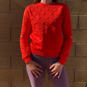 Bright orange bubble texture elbow cutout sweater